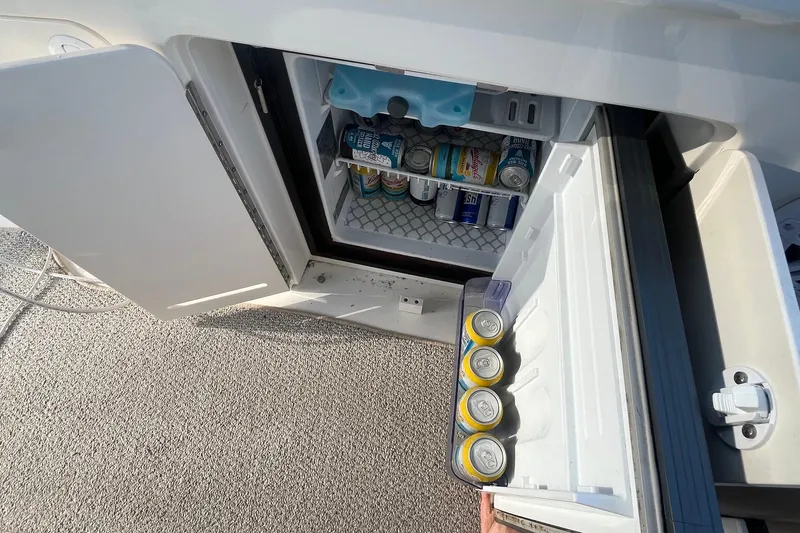 Slide: The Image of Mini fridge stocked with beverages on a 2001 Sea Ray 340 Sundancer boat. - 16