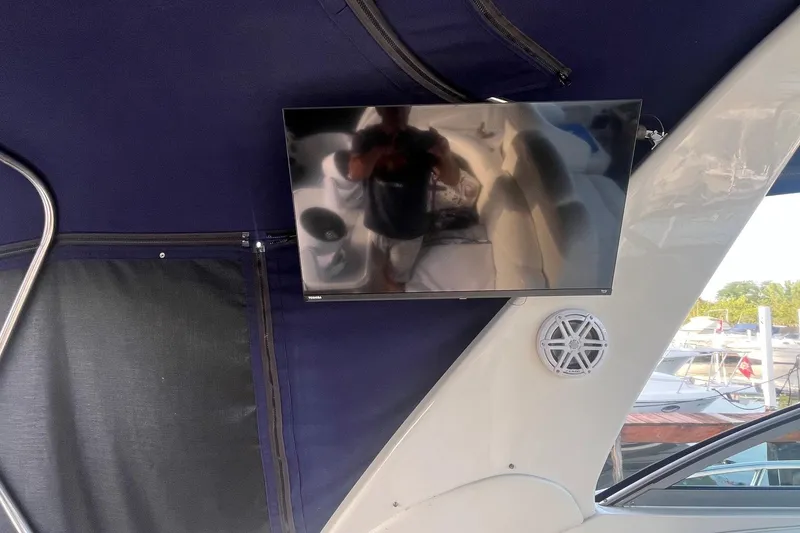 Slide: The Image of Flat-screen TV and speaker on 2001 Sea Ray 340 Sundancer boat interior. - 18