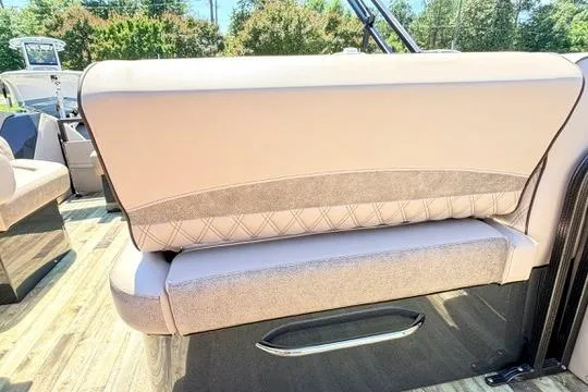 Slide: The Image of 2020 Crest Savannah 250 SLS boat interior with beige seating and elegant design. - 13