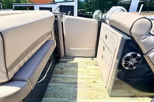 Slide: The Image of Interior of 2020 Crest Savannah 250 SLS boat with seating and storage compartments. - 14