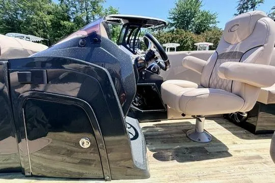 Slide: The Image of 2020 Crest Savannah 250 SLS boat interior with plush seating and sleek dashboard design. - 16