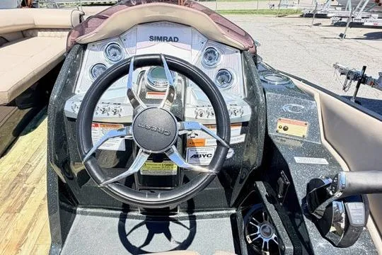 Slide: The Image of 2020 Crest Savannah 250 SLS boat dashboard with steering wheel and control panel. - 18