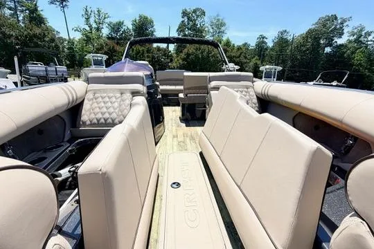 Slide: The Image of 2020 Crest Savannah 250 SLS pontoon boat with luxurious seating and spacious deck. - 21