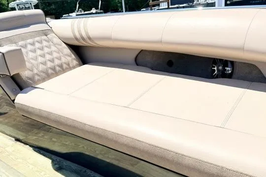 Slide: The Image of Luxurious seating on 2020 Crest Savannah 250 SLS boat, featuring beige upholstery and diamond stitching. - 22