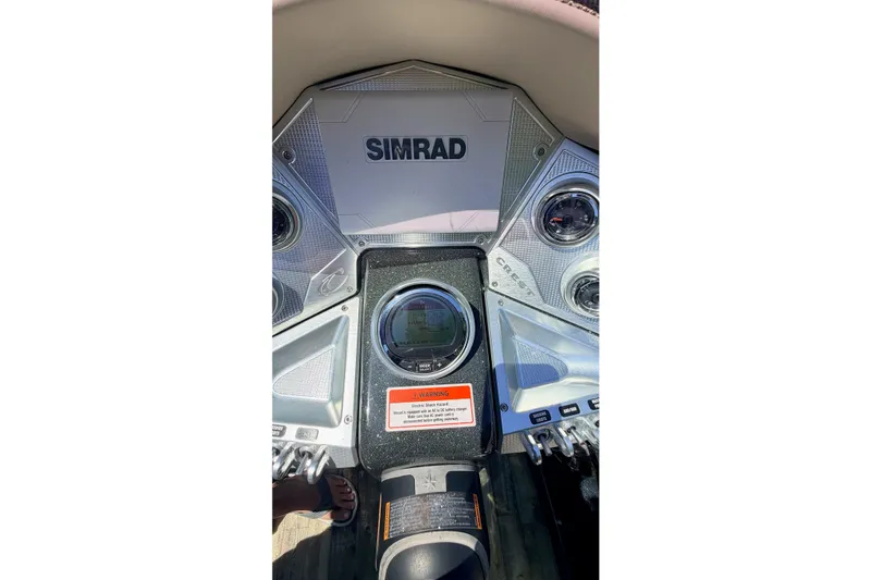 Slide: The Image of Dashboard of 2020 Crest Savannah 250 SLS boat with Simrad display. - 8