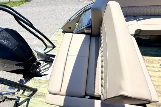 Slide: The Image of 2020 Crest Savannah 250 SLS boat with beige seating and outboard motor. - 9