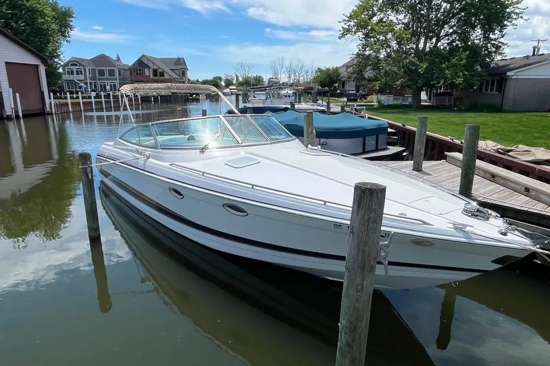 The Image of 2002 Formula 330 Sun Sport boat docked in a scenic marina setting. - 0