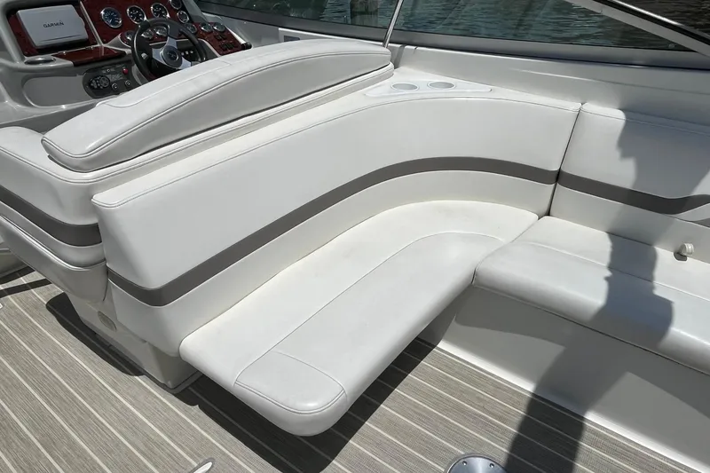 Slide: The Image of 2002 Formula 330 Sun Sport boat interior with white seating and dashboard. - 10