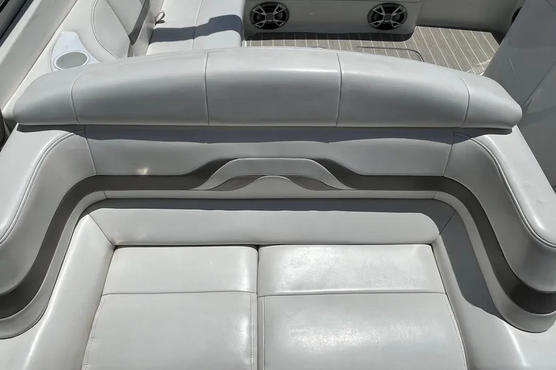 Slide: The Image of 2002 Formula 330 Sun Sport boat interior with gray leather seating and cup holders. - 12