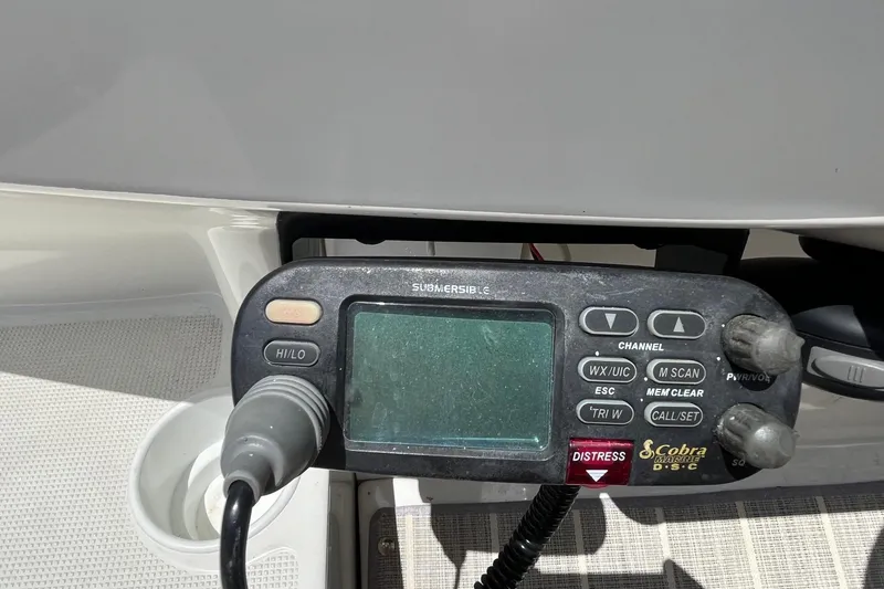 Slide: The Image of VHF marine radio on a 2002 Formula 330 Sun Sport boat dashboard. - 15