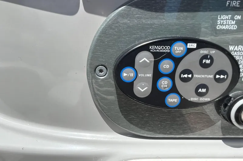 Slide: The Image of Kenwood audio control panel on 2002 Formula 330 Sun Sport boat dashboard. - 16