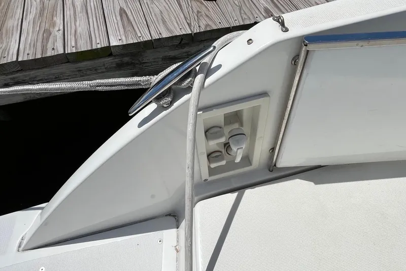 Slide: The Image of 2002 Formula 330 Sun Sport boat deck with control panel and dock view. - 17