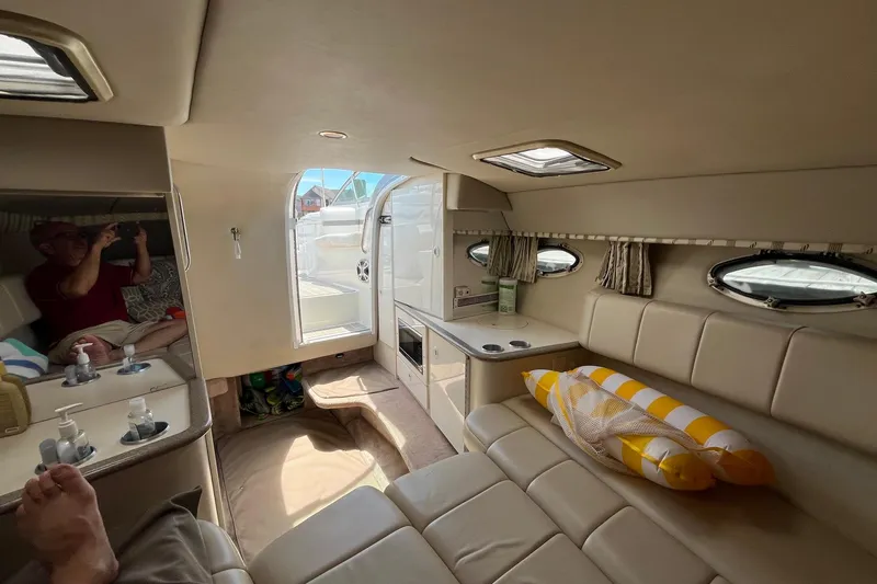 Slide: The Image of Interior of 2002 Formula 330 Sun Sport boat with seating and portholes. - 22