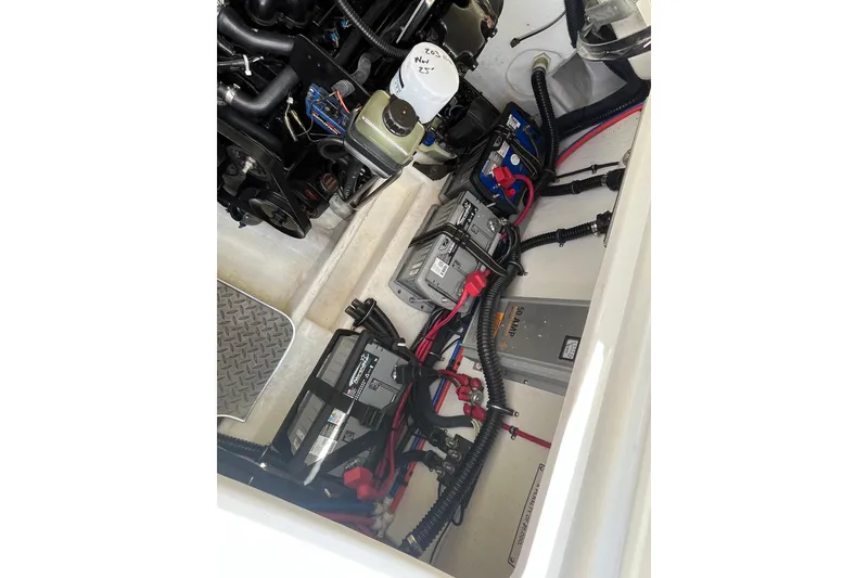 Slide: The Image of Engine compartment of a 2002 Formula 330 Sun Sport boat, showing batteries and wiring. - 32