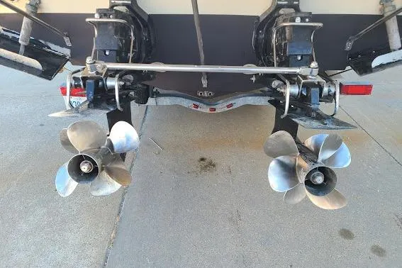 Slide: The Image of 2002 Formula 330 Sun Sport boat with dual propellers on a trailer. - 35