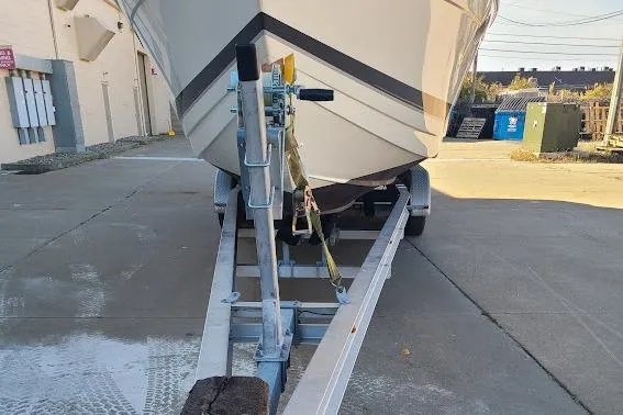 Slide: The Image of 2002 Formula 330 Sun Sport boat on trailer, parked outdoors on concrete surface. - 39