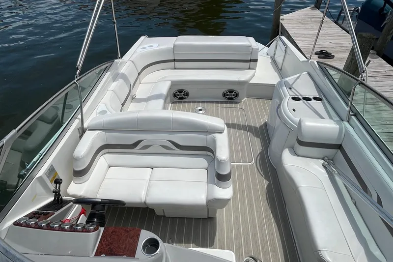 Slide: The Image of 2002 Formula 330 Sun Sport boat interior with white seating and wood accents. - 4