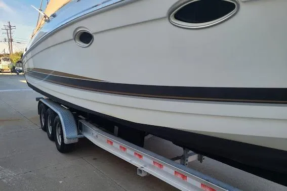 Slide: The Image of 2002 Formula 330 Sun Sport boat on a trailer, side view. - 40