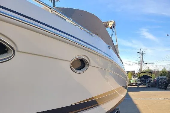 Slide: The Image of 2002 Formula 330 Sun Sport boat docked under clear blue sky. - 41