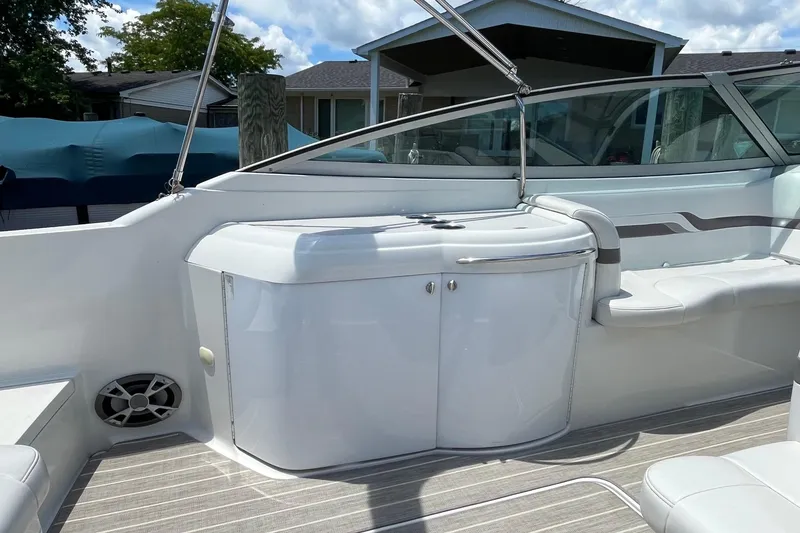 Slide: The Image of 2002 Formula 330 Sun Sport boat interior with sleek white seating and cabinetry. - 7
