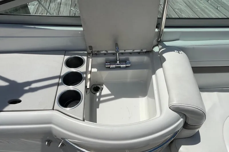 Slide: The Image of 2002 Formula 330 Sun Sport boat sink and cup holders on deck. - 8