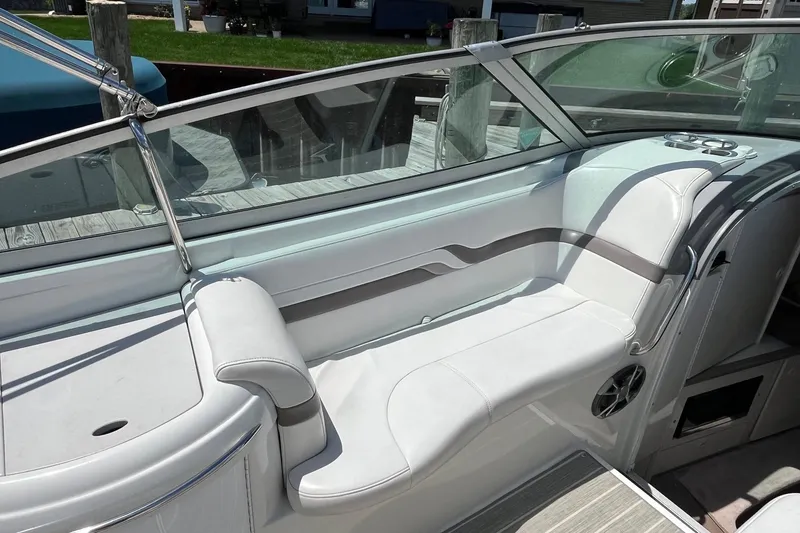 Slide: The Image of 2002 Formula 330 Sun Sport boat interior with white seating and sleek design. - 9