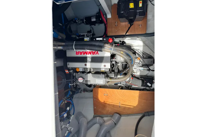 Slide: The Image of Engine compartment of a 2025 Lagoon 46 catamaran featuring a Yanmar engine. - 13