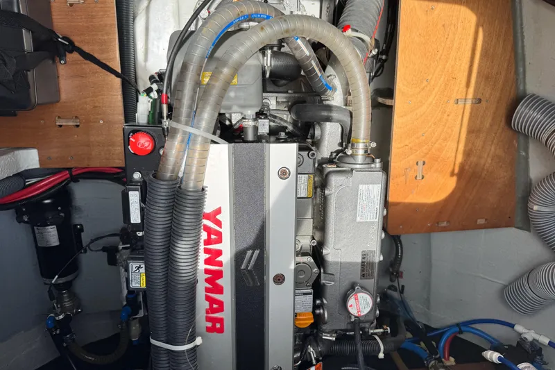 Slide: The Image of Engine compartment of a 2025 Lagoon 46 catamaran featuring a Yanmar engine. - 14