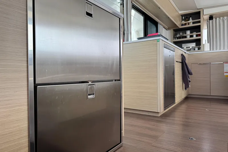 Slide: The Image of Modern kitchen interior of 2025 Lagoon 46 yacht with stainless steel appliances. - 20
