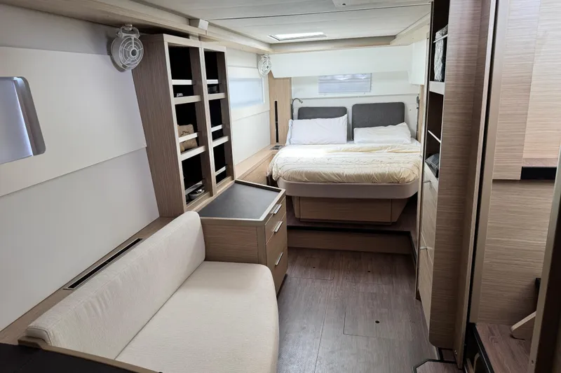 Slide: The Image of Luxurious interior of 2025 Lagoon 46 yacht featuring a cozy bedroom and modern furnishings. - 21