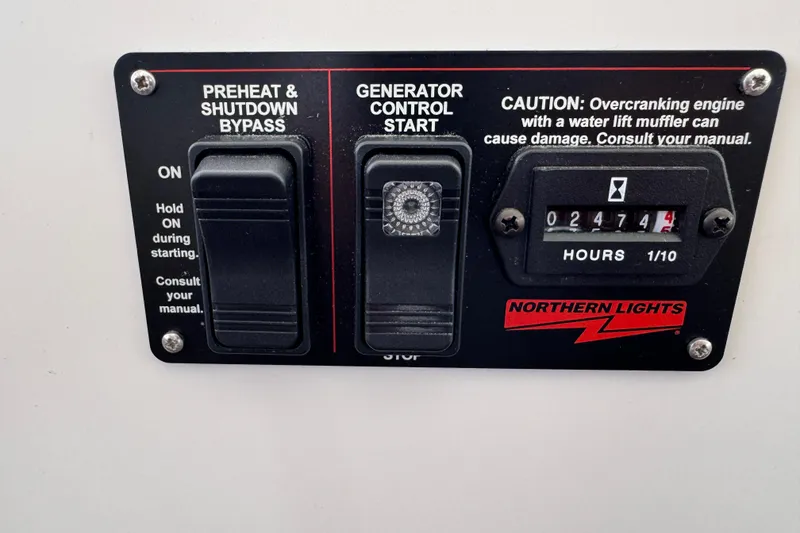 Slide: The Image of Control panel of a 2025 Lagoon 46 with generator hour meter and switches. - 27