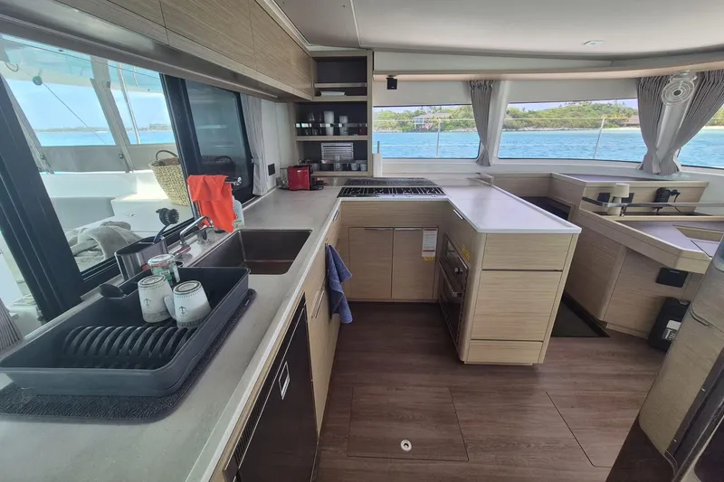 Slide: The Image of Modern kitchen interior of 2025 Lagoon 46 yacht with ocean view. - 3