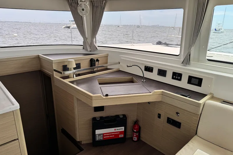Slide: The Image of Modern interior of 2025 Lagoon 46 yacht with sleek kitchen and ocean view. - 30