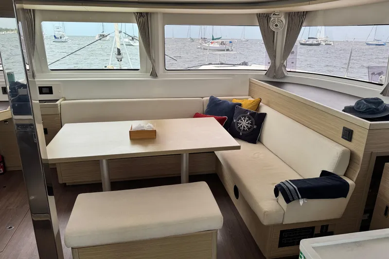 Slide: The Image of Interior of 2025 Lagoon 46 yacht with cozy seating and nautical decor. - 32