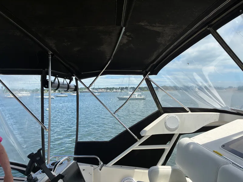 Slide: The Image of View from the flybridge of a Silverton 392 Motor Yacht overlooking water and other boats. - 14