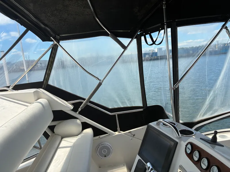 Slide: The Image of Interior view of a 2001 Silverton 392 Motor Yacht overlooking the water. - 15