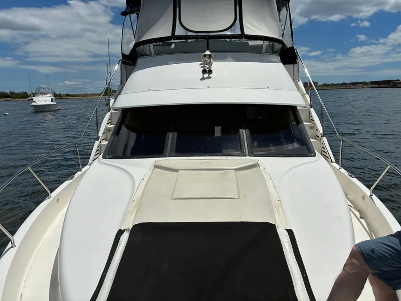 Slide: The Image of A 2001 Silverton 392 Motor Yacht on the water. - 16