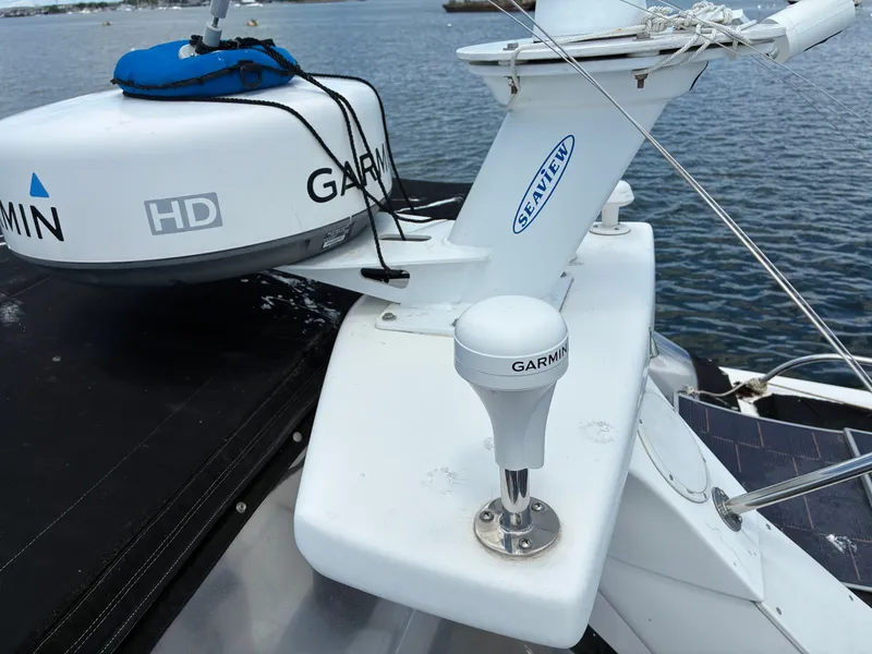Slide: The Image of A 2001 Silverton 392 Motor Yacht with Garmin equipment on deck, on calm water. - 20