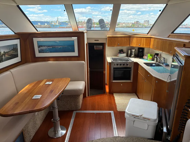 Slide: The Image of Interior of a 2001 Silverton 392 Motor Yacht with kitchen and seating area. - 22
