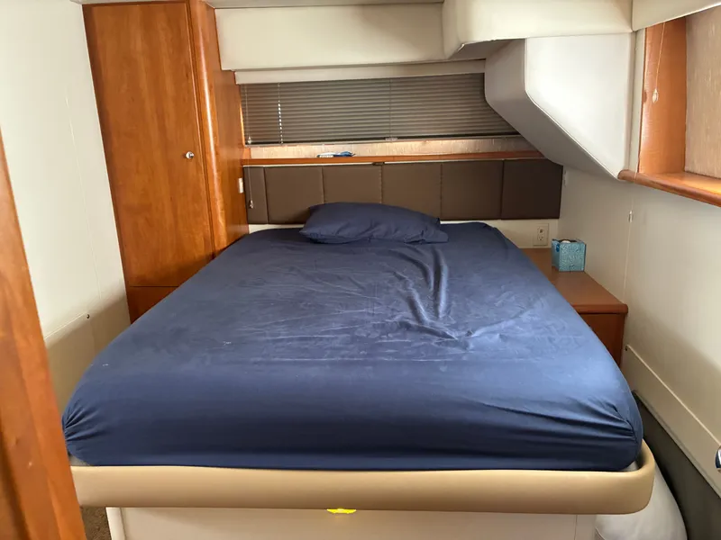Slide: The Image of The image shows a cozy cabin with a double bed and wooden furnishings. - 36