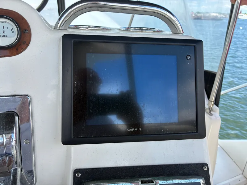 Slide: The Image of A Garmin navigation system is mounted on the helm of a 2001 Silverton 392 Motor Yacht. - 40