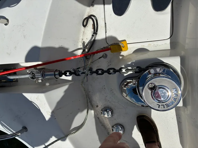 Slide: The Image of Close-up of an anchor system on a boat with chain and winch. - 43