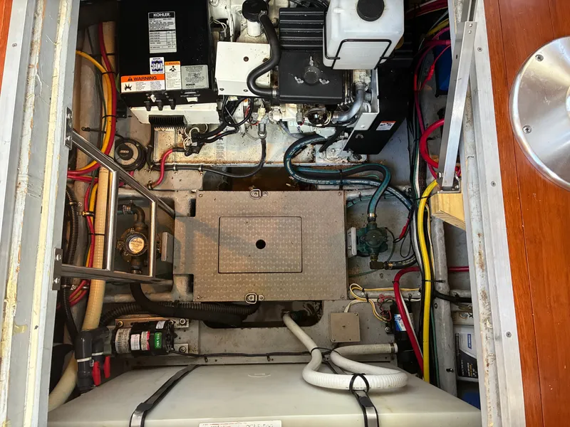 Slide: The Image of Engine room of the 2001 Silverton 392 Motor Yacht with various cables and equipment. - 46