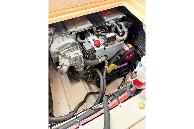 Slide: The Image of Engine compartment of a 2009 Ranger Tugs R-29 boat, showcasing mechanical components. - 19