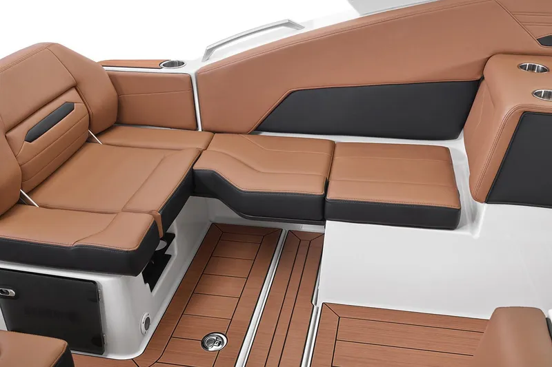 Slide: The Image of Manufacturer Provided Image: Luxurious seating on 2026 Yamaha Boats 295SD, featuring brown and black upholstery. - 26