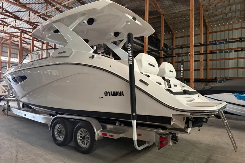 Slide: The Image of 2026 Yamaha Boats 295SD in storage, showcasing sleek design and modern features. - 3