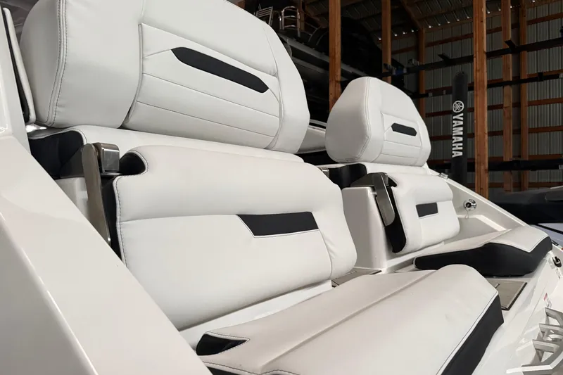 Slide: The Image of Luxury seating on 2026 Yamaha Boats 295SD, featuring sleek white and black upholstery. - 5