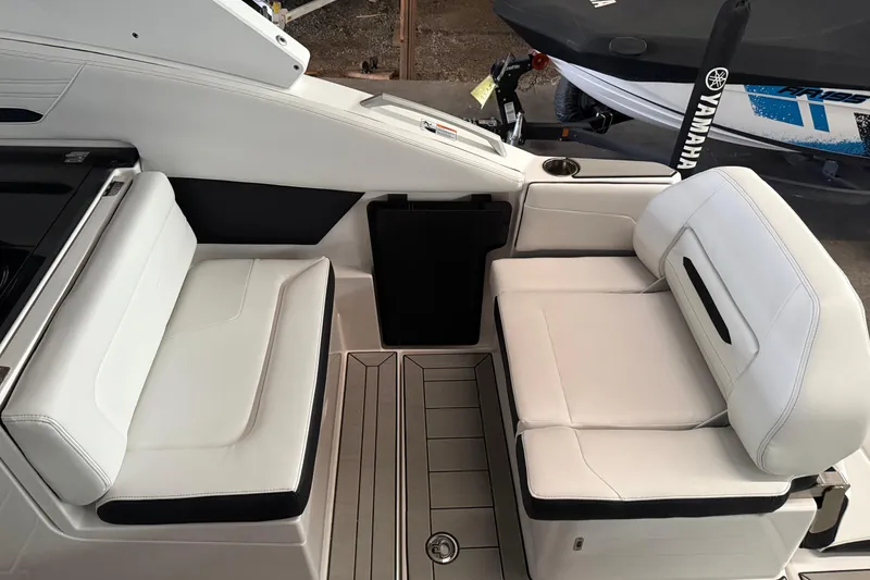 Slide: The Image of Interior seating of 2026 Yamaha Boats 295SD, featuring sleek white upholstery and modern design. - 8