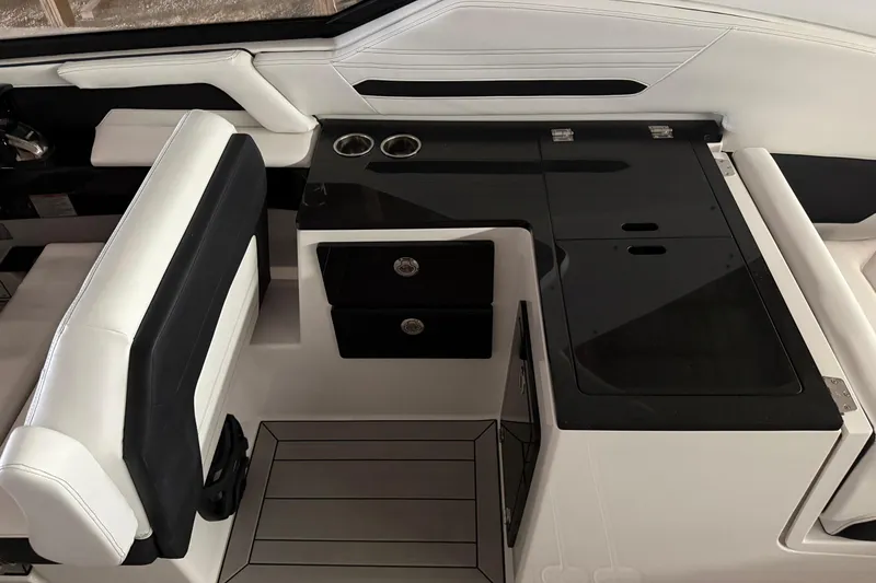 Slide: The Image of Interior of 2026 Yamaha Boats 295SD, featuring sleek seating and modern console design. - 9