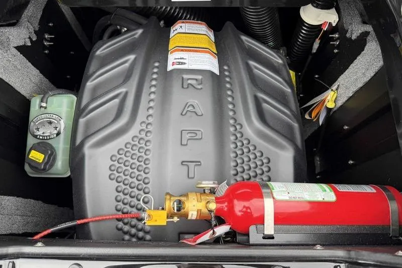 Slide: The Image of Engine compartment of 2026 Supra SA with fire extinguisher and coolant reservoir. - 2